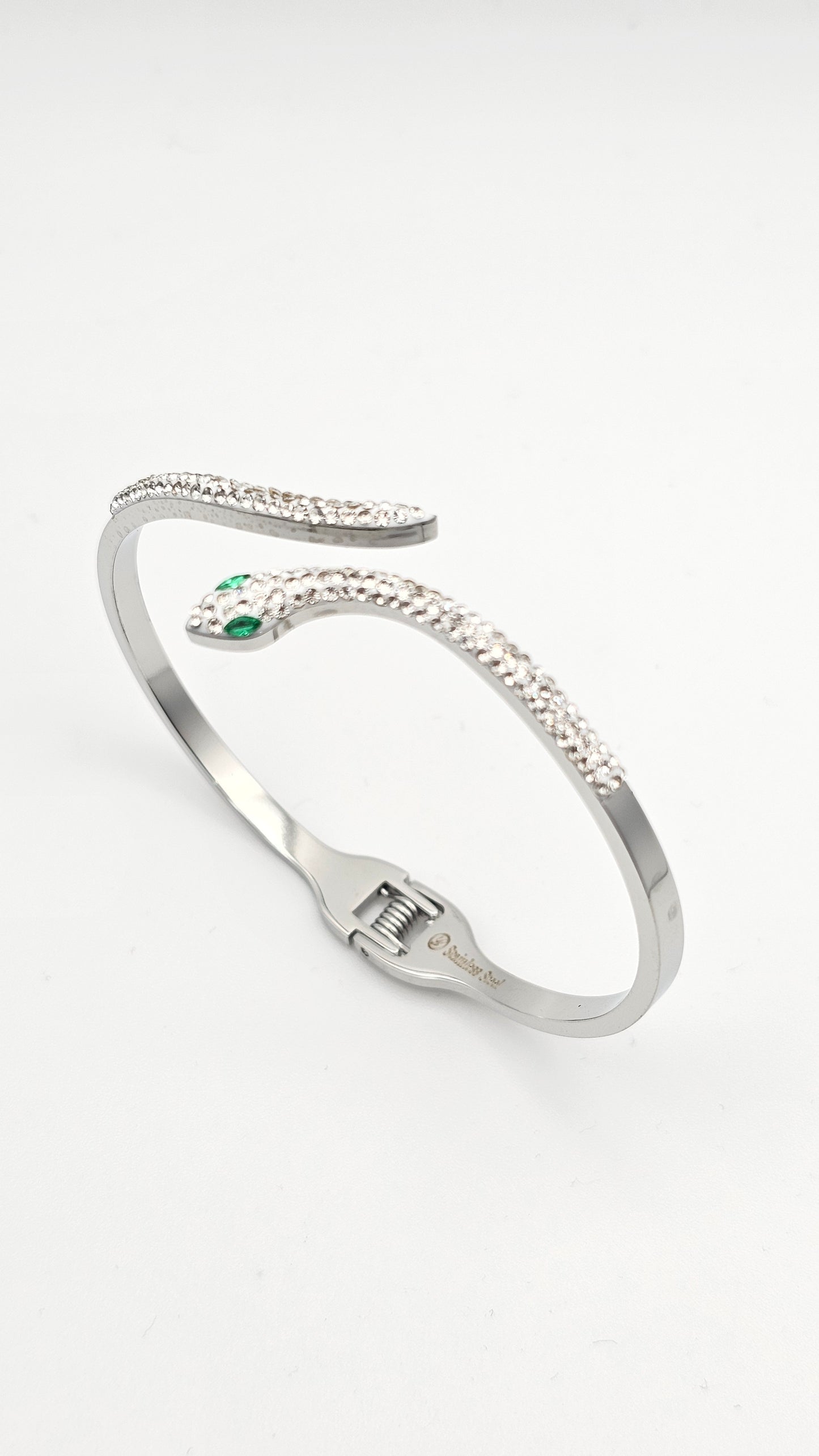 Serpentine Motif Bangle with green and white stone accents